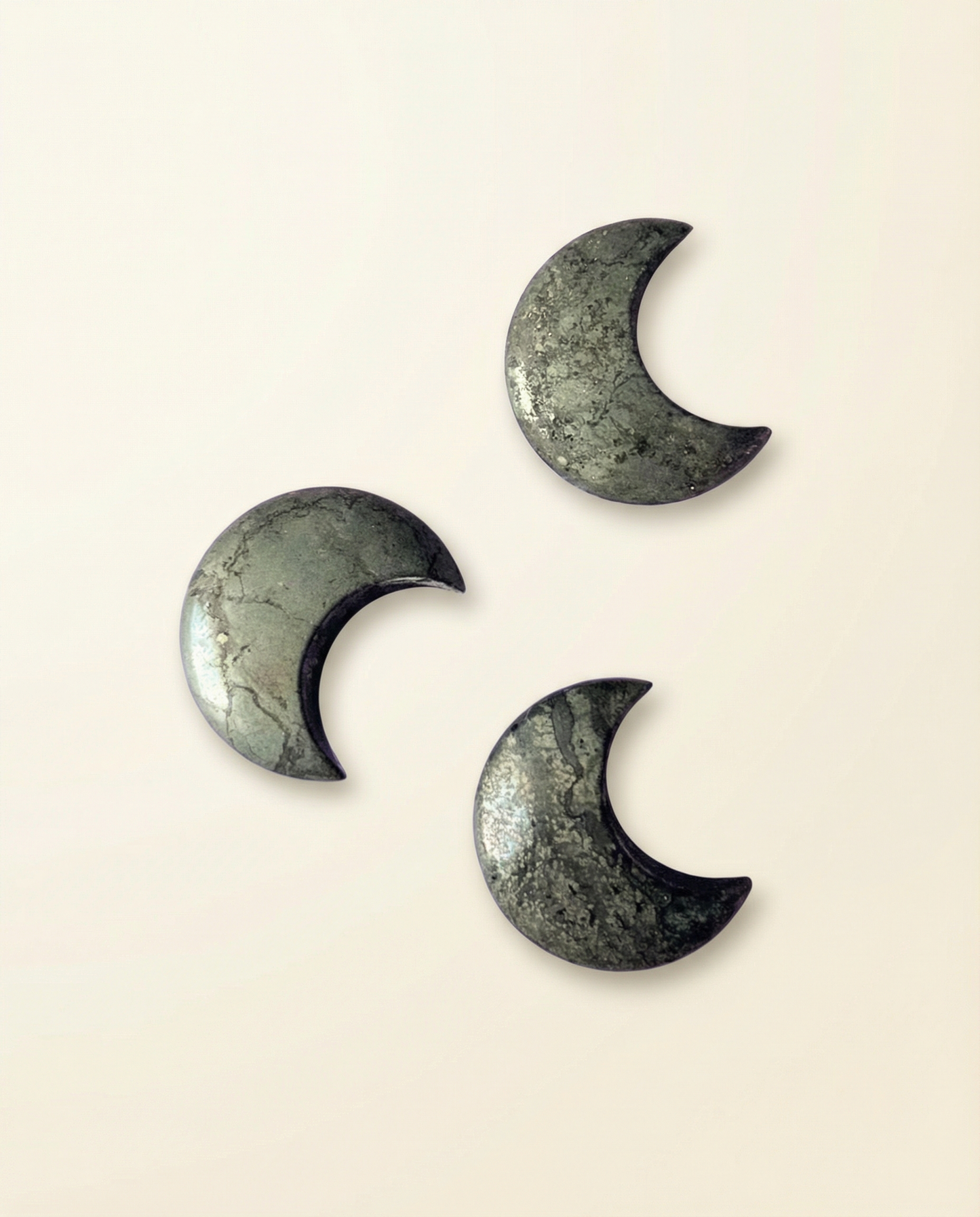 Pyrite crescent moon carvings