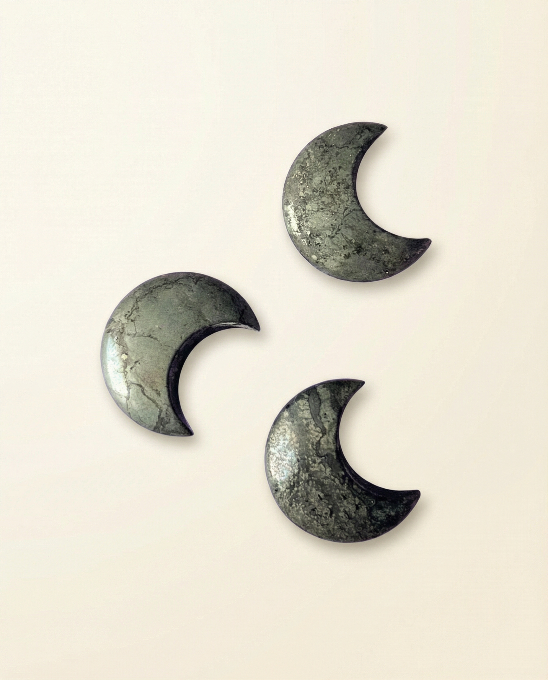 Pyrite crescent moon carvings